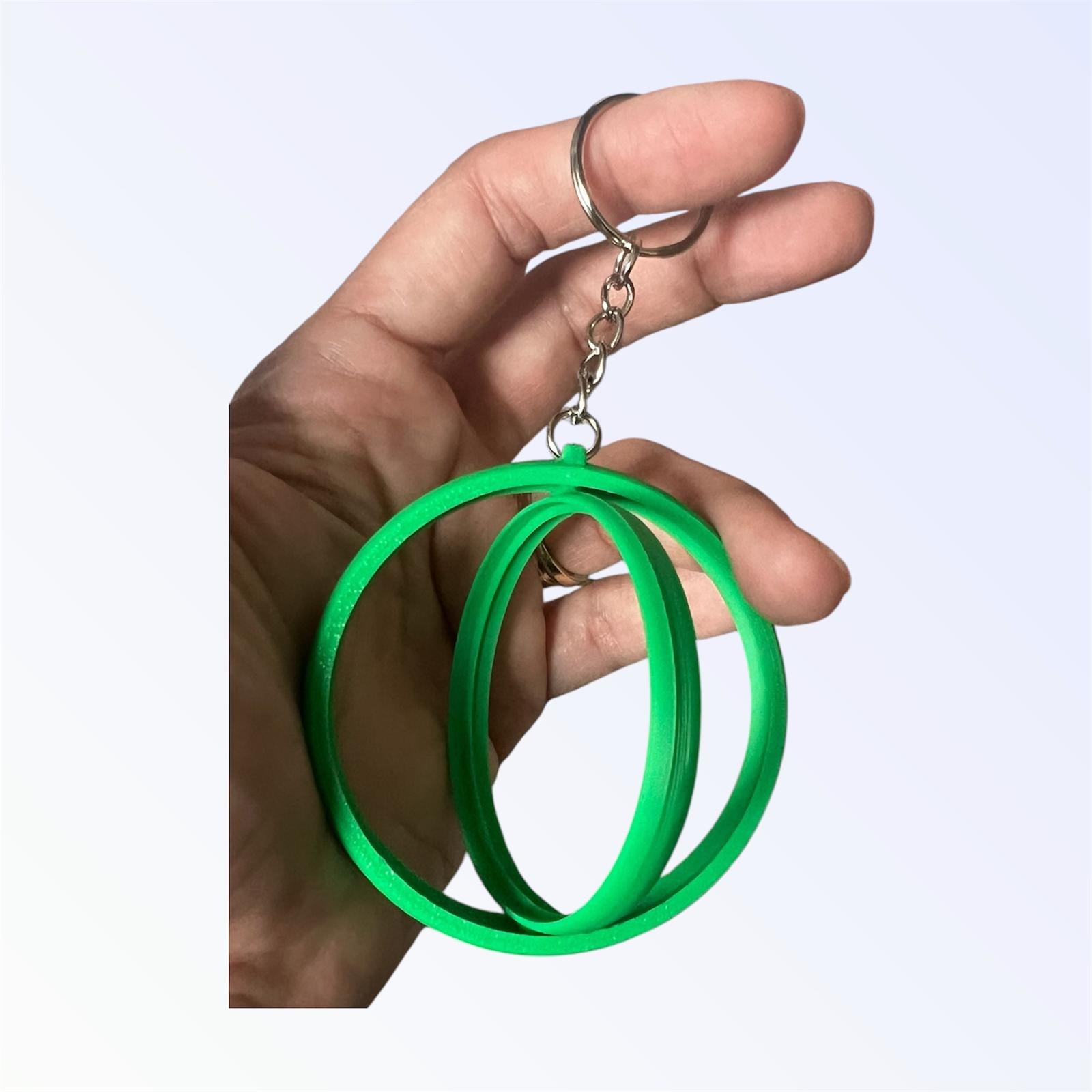 Green 2.25-inch rotating button keychain blank designed for standard flat back buttons, double-sided spinner keychain for custom button makers and DIY crafts.