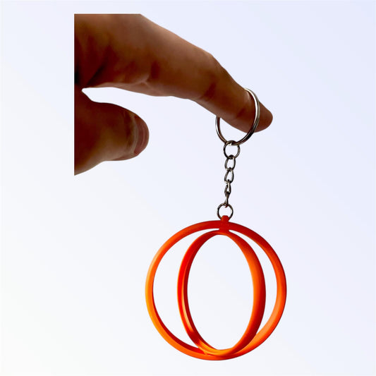 Orange 2.25-inch rotating button keychain blank designed for standard flat back buttons, double-sided spinner keychain for custom button makers and DIY crafts.