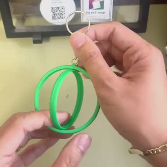 Green 2.25-inch rotating button keychain blank designed for standard flat back buttons, double-sided spinner keychain for custom button makers and DIY crafts.